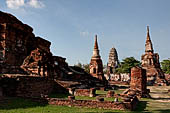 Ayutthaya, Thailand. Wat Mahathat, the N-E corner of the main precint with two auxiliary chedi and the ruins of the central prang. Note the Wat Ratchaburana in the distance. 